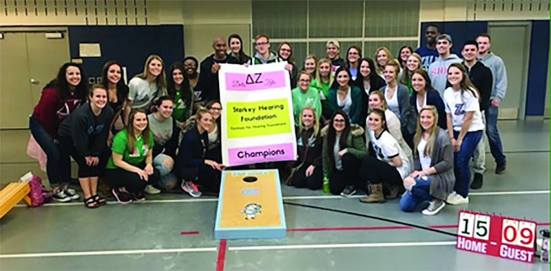 SU students and members of Delta Zeta sorority participated in a corn hole tournament to raise money to support the Starkey Hearing Foundation.