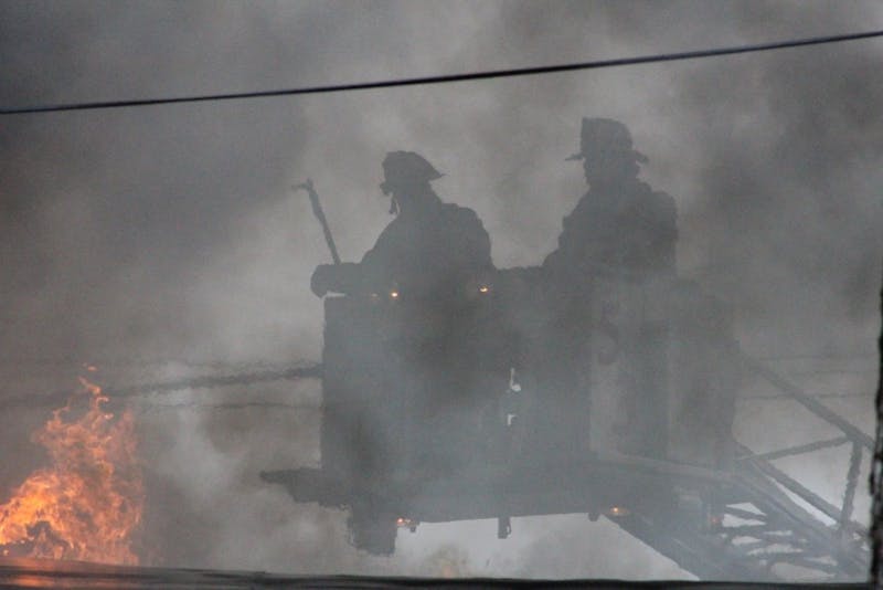 Firefighters combat a blaze at the McCune Lumber Co. fire last April.