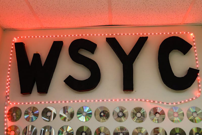 "We Serve Your Community." WSYC letters in studio's office.