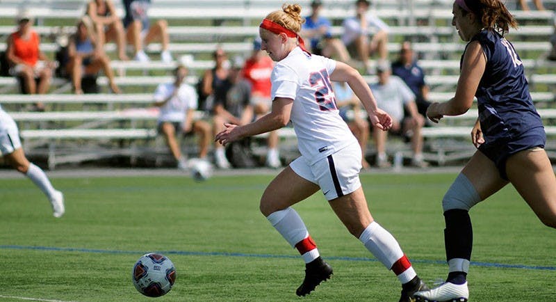 Junior Mara Bowman looks to set up a teammate against Shepherd’s defense Wednesday afternoon.