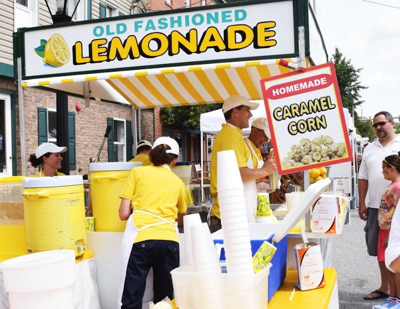 Shippensburg residents enjoy fresh lemonade on a hot summer day at the annual CornFest.