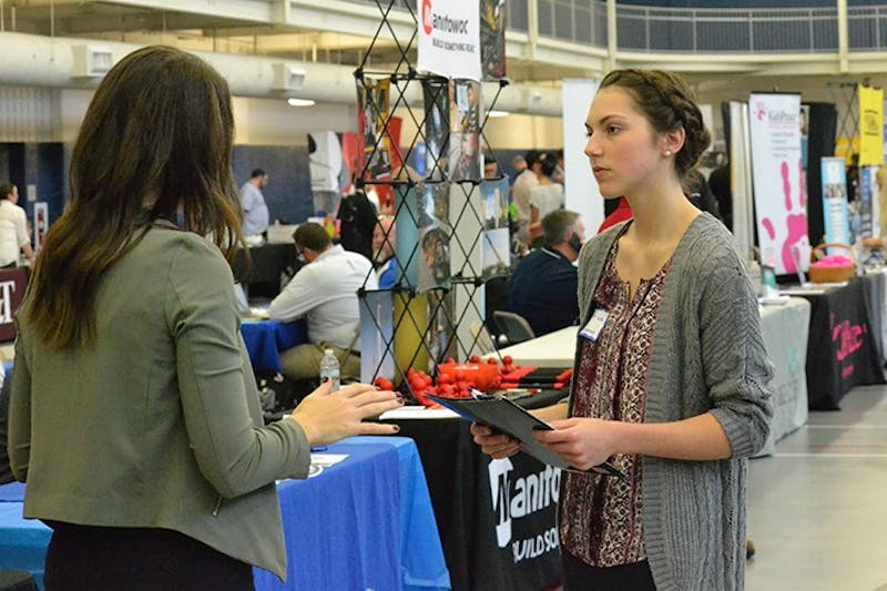 An SU student speaks with a potential employer at the career fair held Thursday. More than 100 businesses came to the event to speak with students.