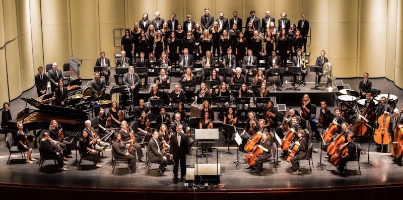 The Shippensburg University Orchestra and the SU Concert Choir pose for a group photo at the H. Ric Luhrs Performing Arts Center.