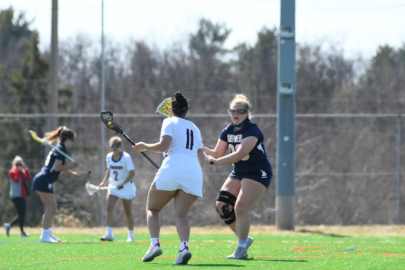 Sophomore Sydney Costanza (No. 11) goes head-to-head with a Shepherd University defender last Saturday. 
