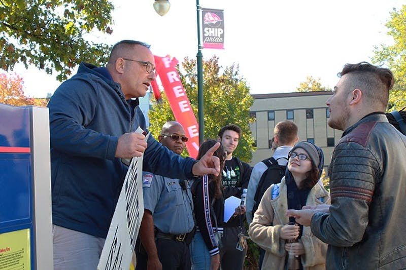 Mike Stockwell, of New York, speaks with a member of the crowd. This is the third year religious demonstrators have been spotted on Shippensburg University's campus in the fall for "sin awareness."&nbsp;