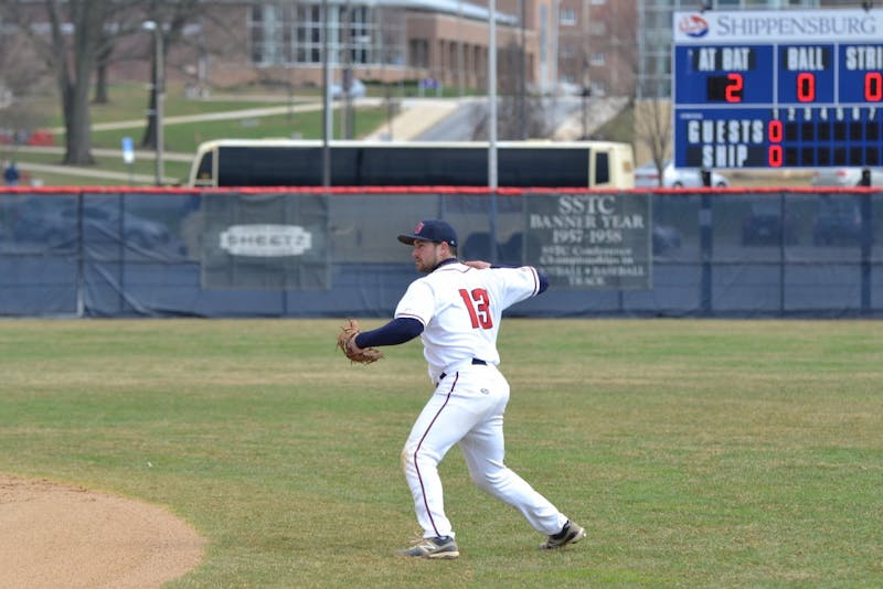 	Jimmy Spanos throws out a Golden Bear runner from deep in the hole at second base. 