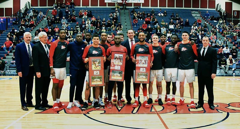 Three seniors are honored before the game against West Chester University on Wednesday: (from left to right) Antonio Kellem, student manager Omar Jackson and Manny Span. Kellem had a crucial 21 points — 14 of which came in clutch in the second half. Span contributed a solid eight points and 10 rebounds.&nbsp;