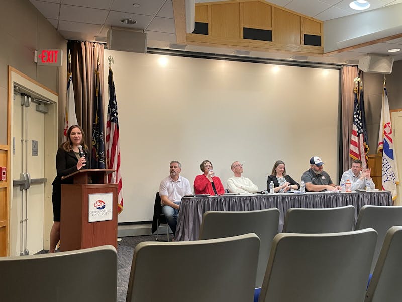 SGA VP of Finance Emily Wojnarski asks online submitted questions at Monday’s meeting.