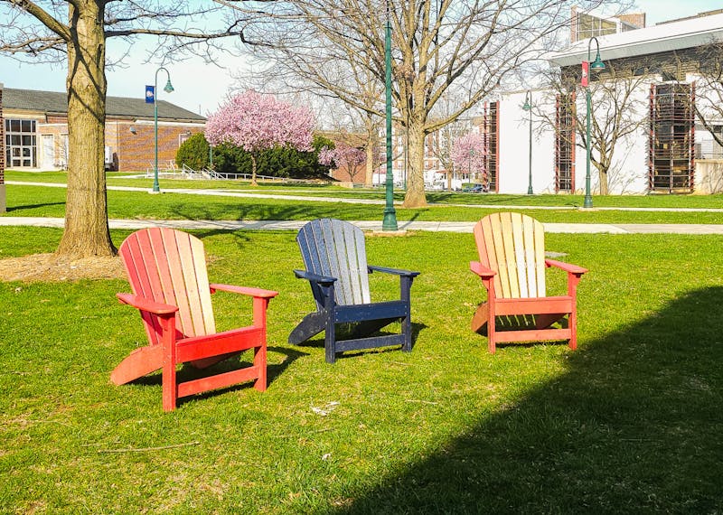 Adirondack chairs outside Rowland Hall on a Spring day.