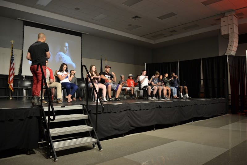 Hypnotized SU students play their imaginary instruments as an award-winning orchestra.