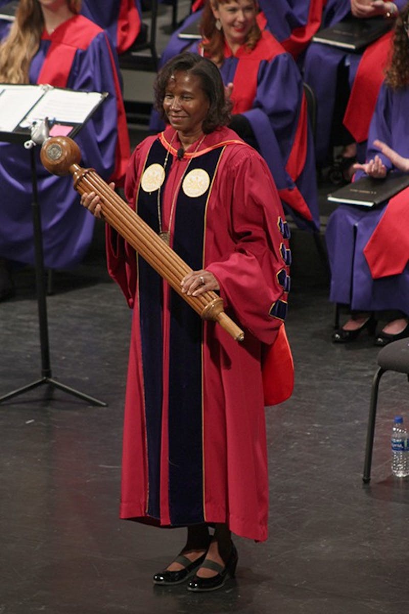 President Laurie Carter stands in front of the Shippensburg University community with the ceremonial mace moments before addressing the crowd.