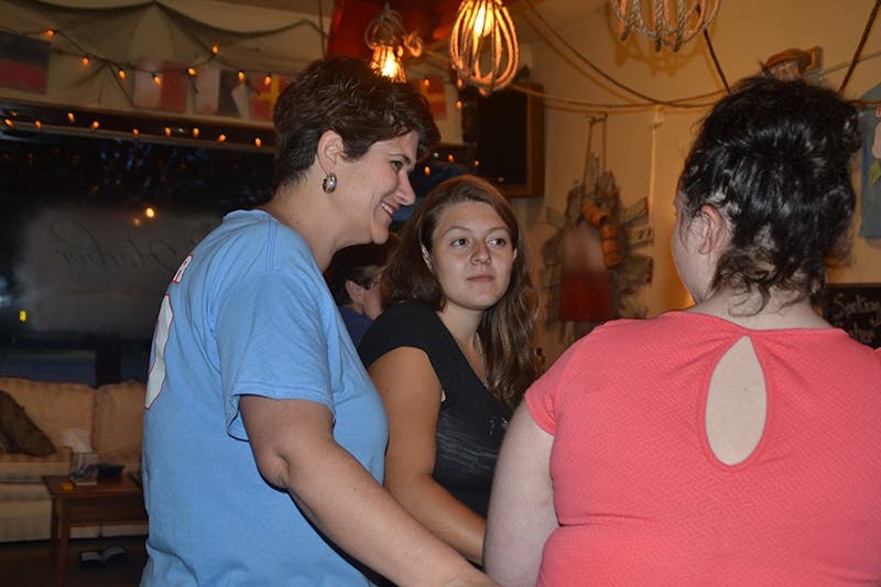 Melissa Mankamyer, left, talks with Lila Crowder and Dela Polca, who are both regulars at The Harbor’s bar each weekend.