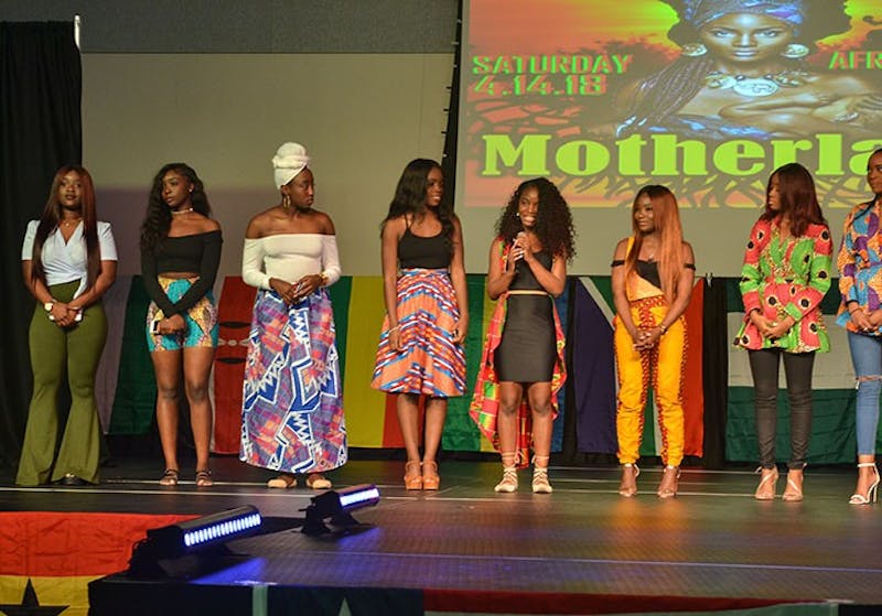 Male and female students flaunted their African attire on stage in the CUB MPR. 