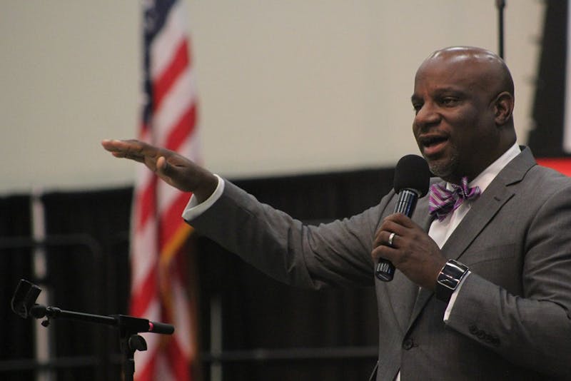 The Rev. Mark Tyler addresses more than a hundred people, discussing racial injustice, wages and education.