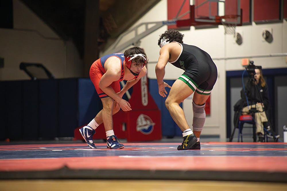 Wrestling wins a close battle at home