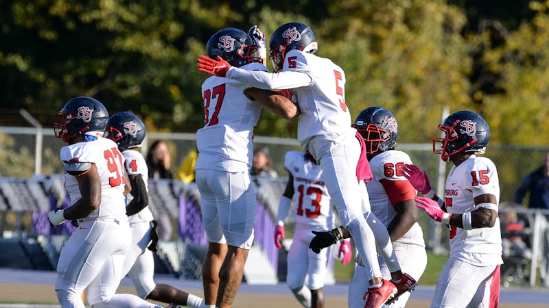 Members of the Shippensburg University football team celebrate after a play during their game against West Chester this past season.