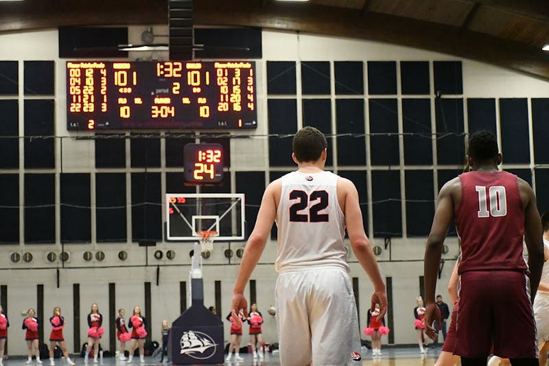 John Castello (22) stands on the low block with Lock Haven’s Christian Kelly late in the second overtime of the Raiders’ double-overtime loss on Saturday. Castello continued his dominance in the defeat, scoring 23 points and pulling down 15 rebounds.