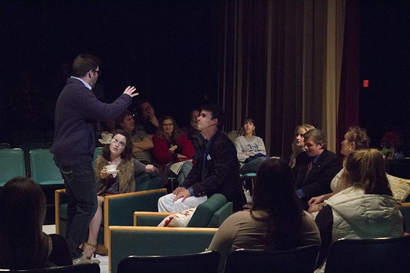 SU theater students exhibit a strong sense of character as the audience watches them perform at a close distance.  
