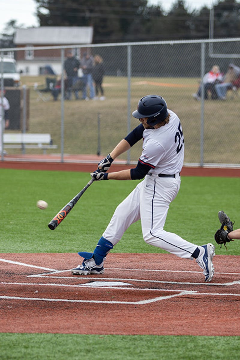 Austin Baal hitting the ball in the match against Pitt-Johnstown on Feb.23. Baal went 2-for-4 with a solo home run, an RBI double and two runs scored in the doubleheader against Holy Family.