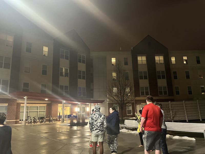 Naugle Resident Assistants wait for residents to exit the building during an evacuation at 11:45 p.m. Jan. 25.