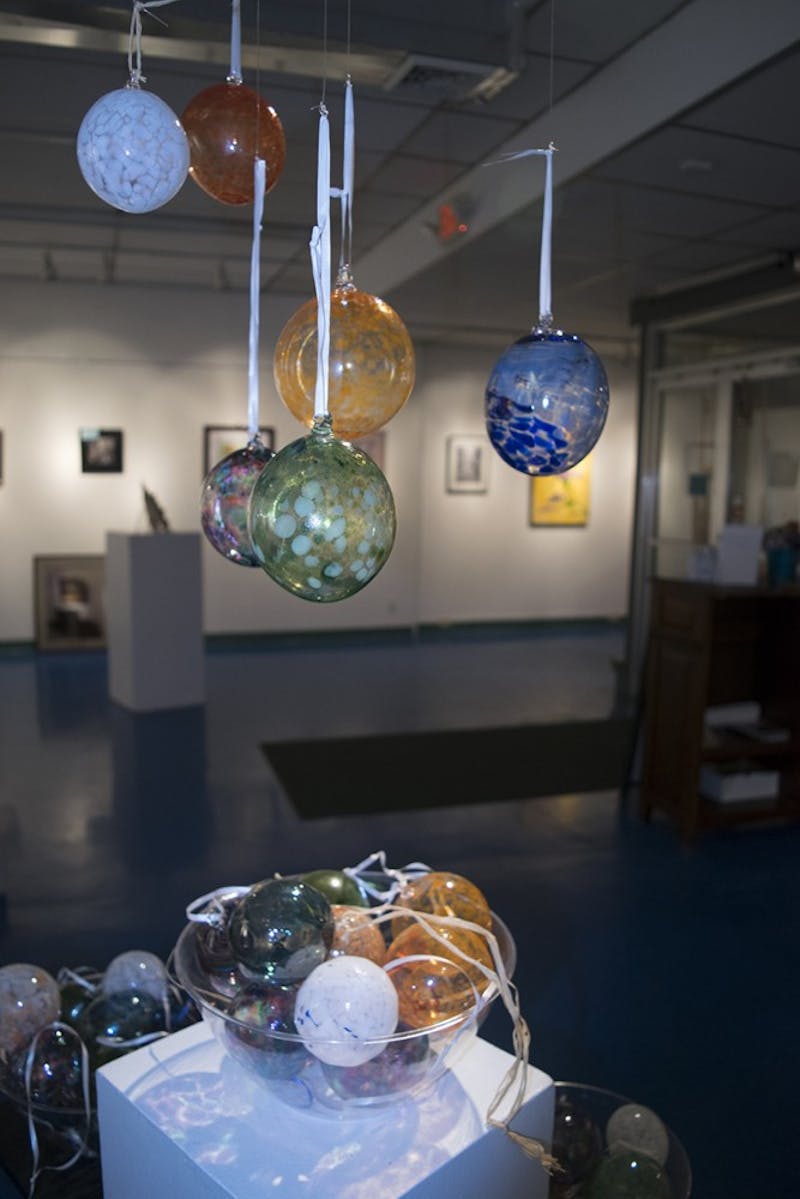 Some art on display for the SHAPE gallery exhibit include Mike Peluso’s ornaments.
