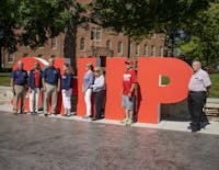Members of the Shippensburg University Class of 1973 pose with the newly dedicated SHIP letters.