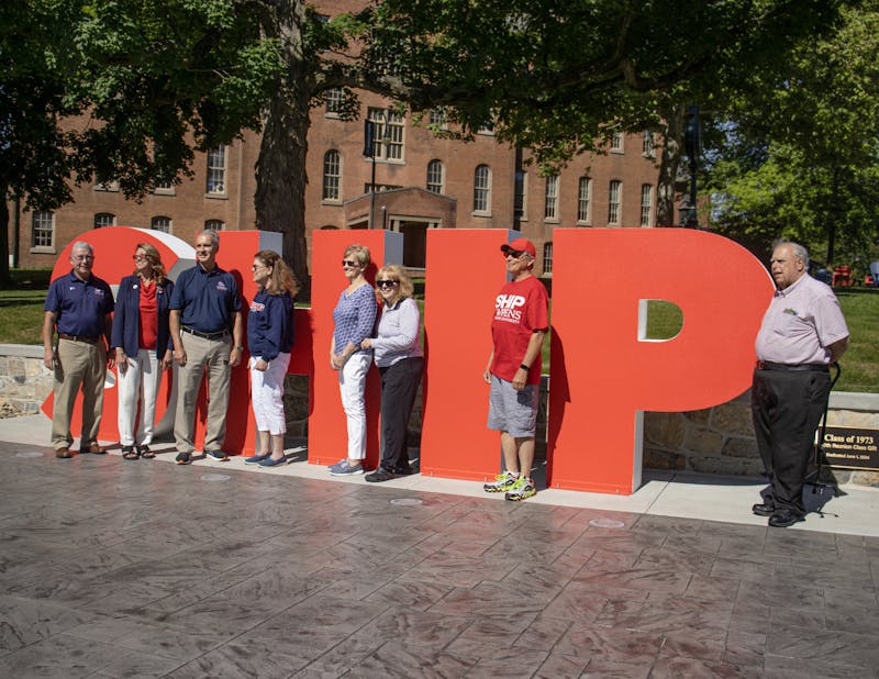 Members of the Shippensburg University Class of 1973 pose with the newly dedicated SHIP letters.