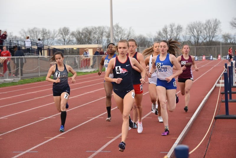 Bella Marchini (front) runs at SU’s 2019 outdoor track-and-field invite. In 2019, she placed fifth at the PSAC Championships in the 5,000-meters (5K).
