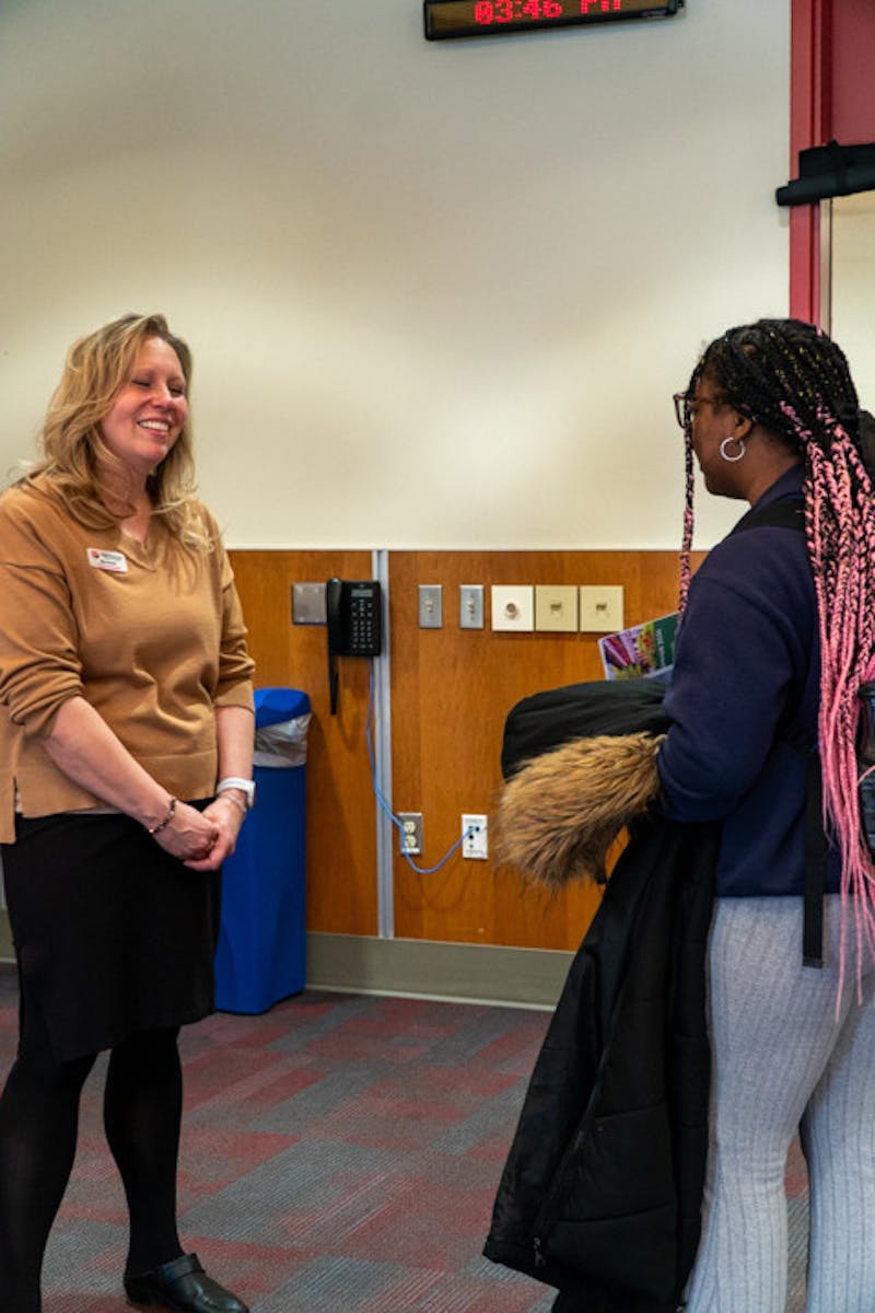 Mary Burnett, director of Global Engagement, speaks with a student about study opportunities.