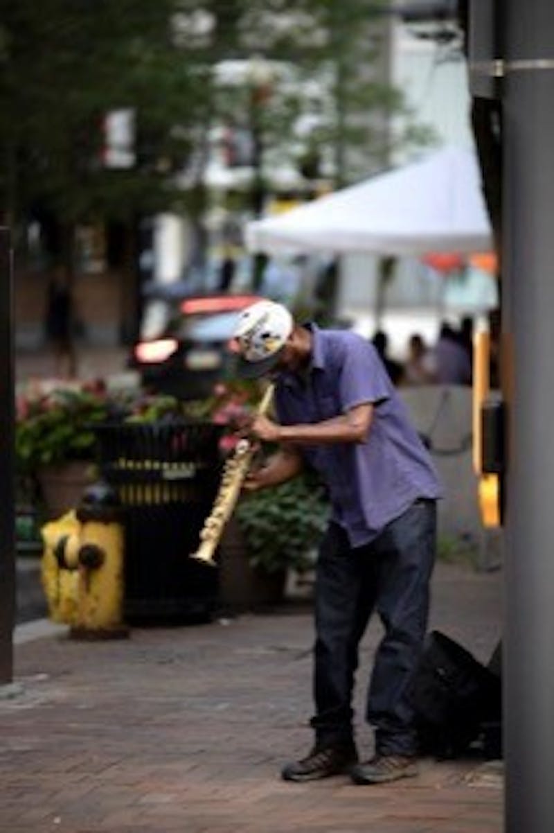 'Saxophone Player' by Matt Hathaway, a senior at Shippensburg University, is featured in 'Alfresco.' This marks Hathaway's debut at SHAPE Gallery.