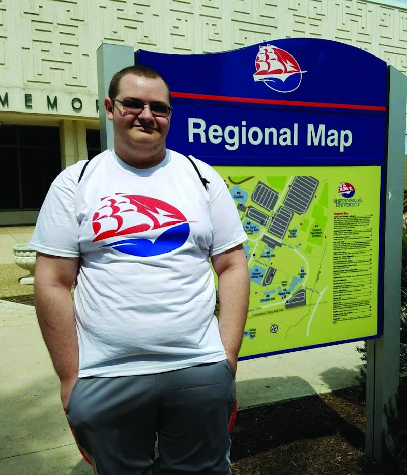 Freshman Ryan Nych, familiarizes himself with SU via the campus map.