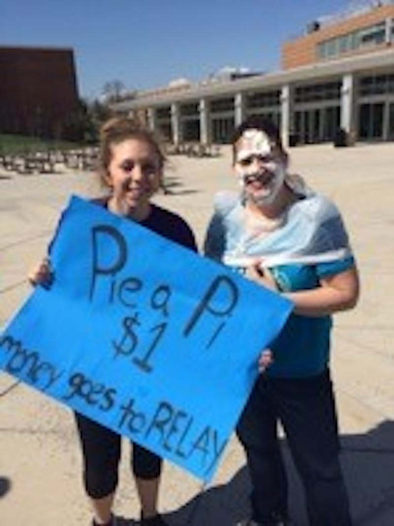 Emilee Danielson-Burke helping out at AOII’s Pie a Pi event.&nbsp;