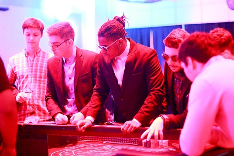 Students fittingly adopt a high roller style at Casino Night Saturday evening. 
