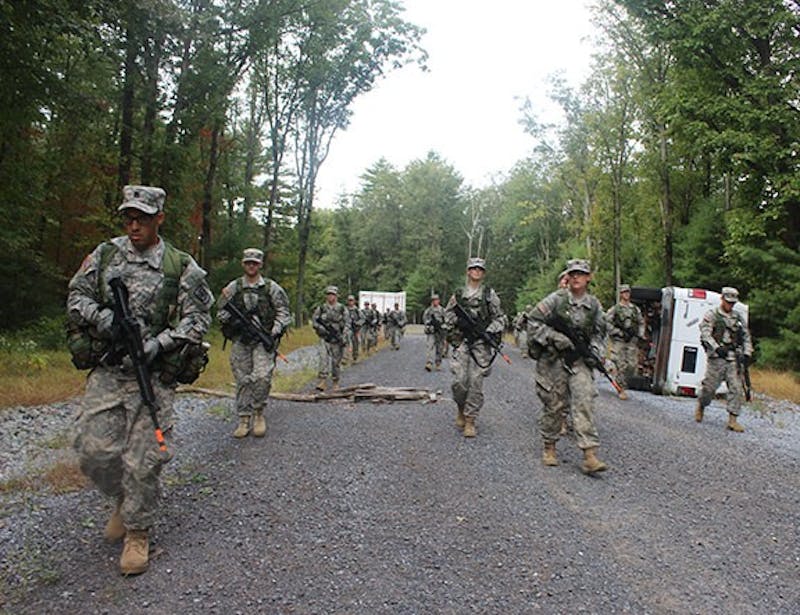 SU ROTC cadets engage in a training exercise. Whether in the woods or on campus, cadets constantly undergo physical tests to meet U.S. Army standards.