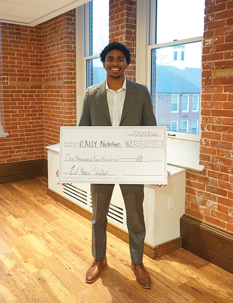 Karim Brice with his cash prize of $1,500 after winning first place at Ship Tank.&nbsp;