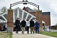 Charles E. Patterson, Dr. George F. “Jody” Harpster, Jo Anne Coy, Anthony Ceddia and Douglas Harbach make the first official walk through the SU Archway. The archway is dedicated in memory of Ship alumnus Jeffrey W. Coy.