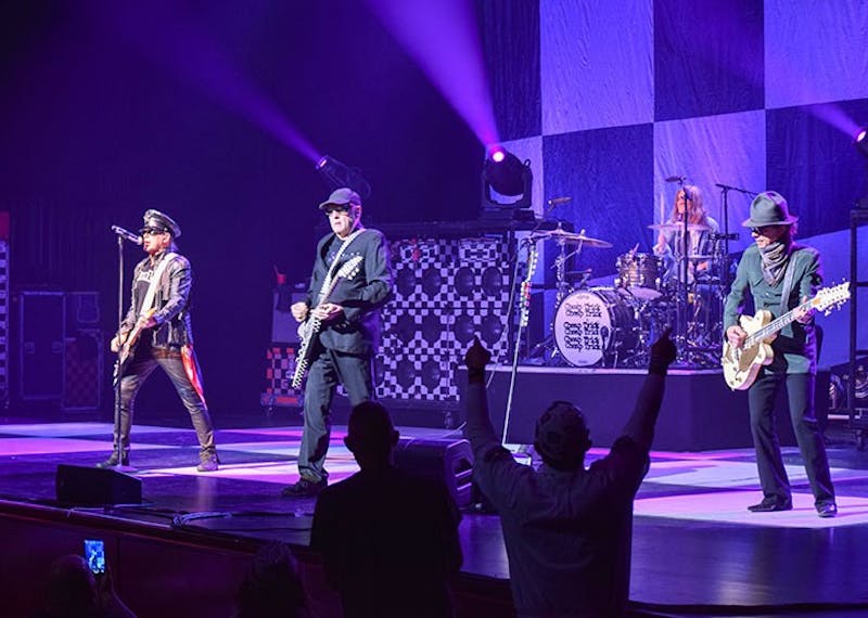 Cheap Trick fans amp the band up with their festive checkered apparel, excited shrills and dance moves.&nbsp;