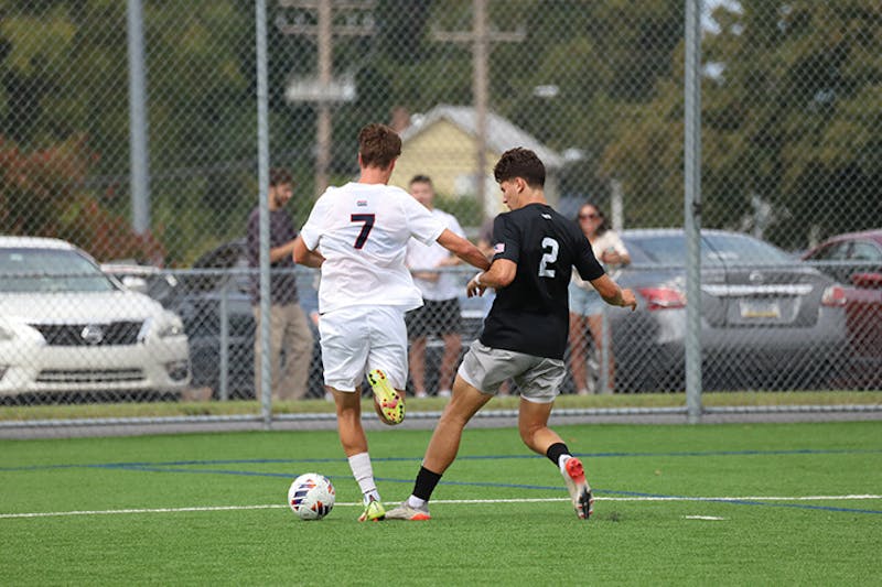 A Slippery Rock player attacks forward Luca Heusser (#7) in the box in the match on Sept.21.