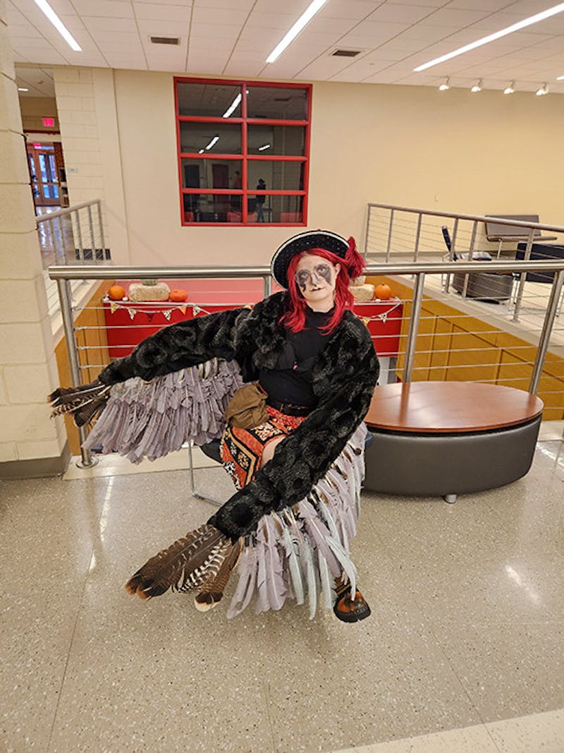 Gabby Hall, winner of the most creative costume award, shows off her Harpy costume.&nbsp;
