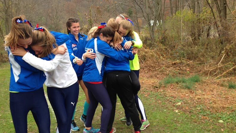 The women’s team celebrates after clinching a third place finish at regionals.