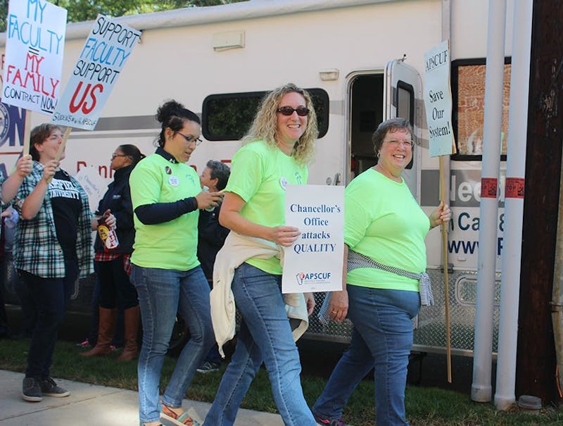 Shippensburg University faculty members spend hours walking the picket line and chanting.