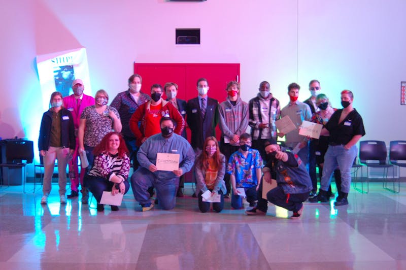 The mystery was ’80s prom night themed, complete with campy movie tropes. Costumed attendees are pictured in a “Class of 1980” photo.