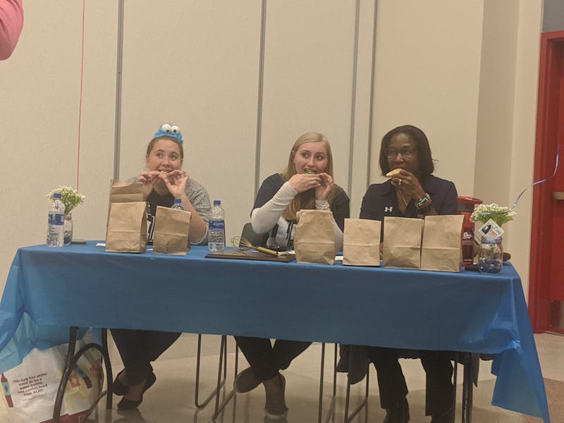 The judges, including SU President Laurie Carter (right), had an hour and a half to de- cide which cookie they thought should go home with the top award of the night.