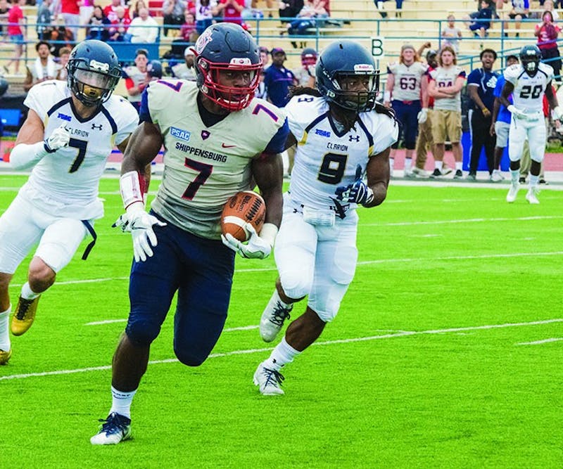 Senior linebacker Allen Holman returns a 32-yard interception for a Shippensburg touchdown.