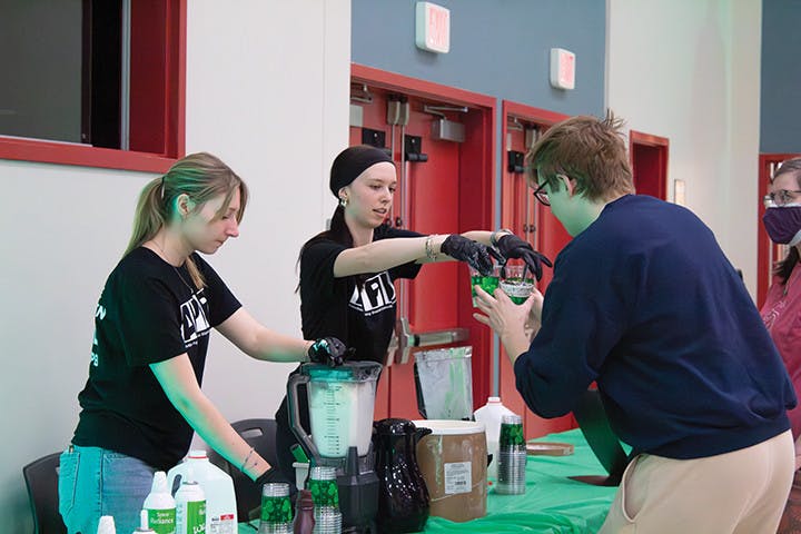 APB members make shamrock milkshakes for SU students at the “Shamrock Shake and Make” event.