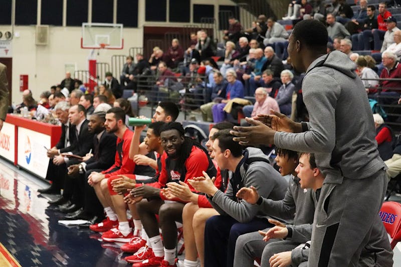 The Raider bench reacts to a bucket during SU’s victory over Kutztown University at Heiges Field House. Head coach Chris Fite praised his bench unit after the game, citing the team’s depth and balance as a key reason for its early success.