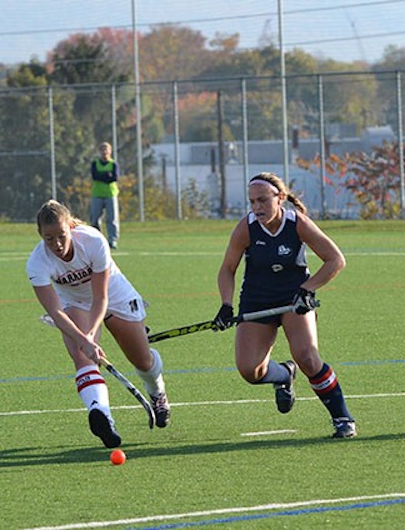 	Senior Katie Shoop (right) earned All-Tournament Team honors for her stellar defensive play in the NCAA playoffs. 