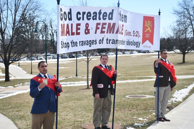 Members of the TFP stood outside Reisner Dining Hall with banners and bagpipes on March 14. Student members of the Silent Witness Peacekeeper Alliance stood near to support fellow students.
