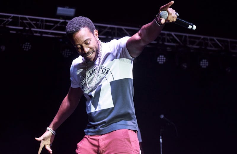 Ludacris extends his arm to the crowd and moves with a beat. The rapper recaptured the energy of his previous work and the response from the audience proved his staying power.