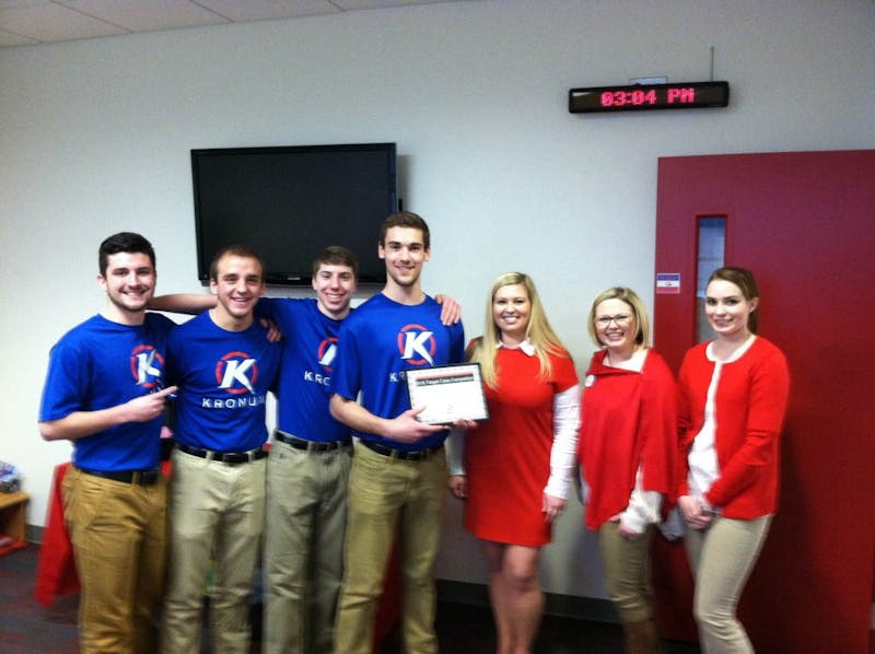 Kronum accepts its first-place win and $1,000 check from the Target Case Competition in the Ceddia Union Building.